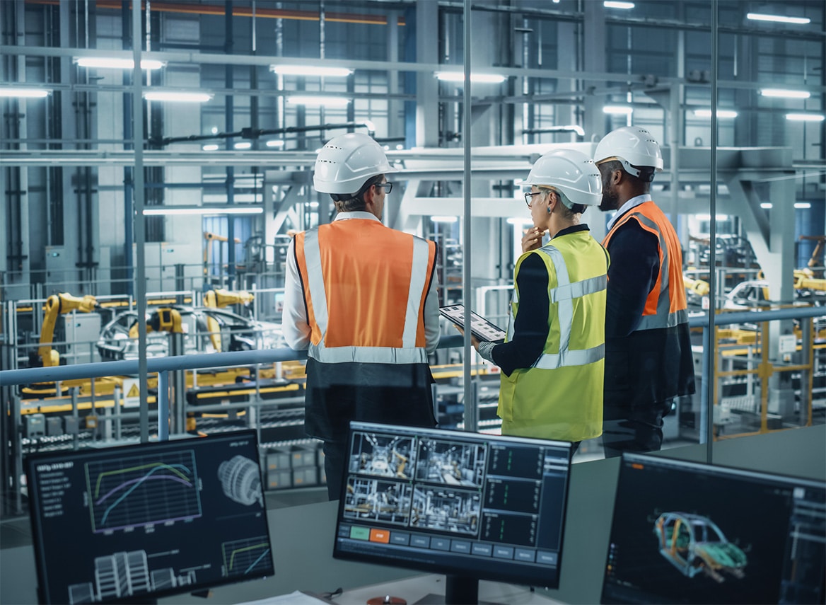 manufacturing workers in hard hats