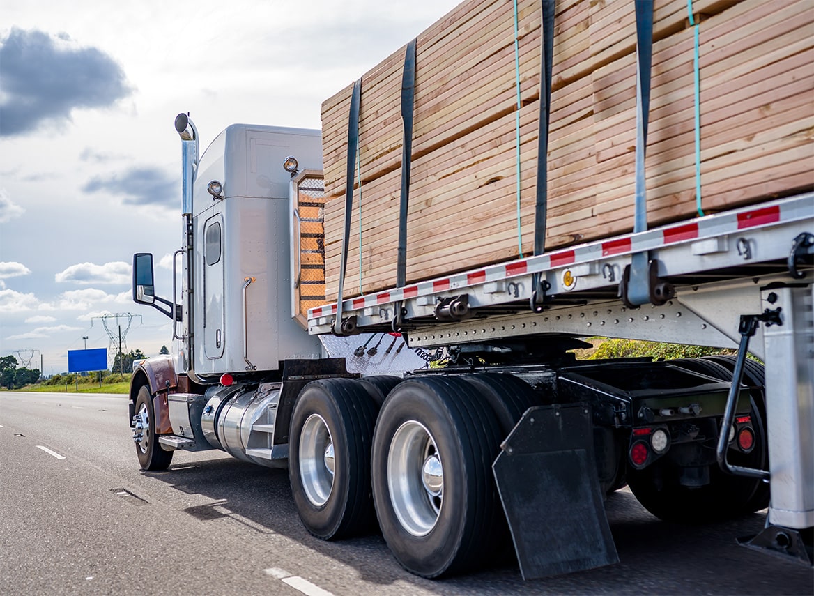 semi carrying wood on highway